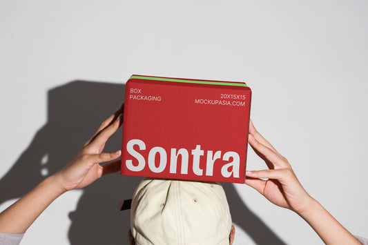 Kraft box packaging mockup with stacked boxes and realistic handheld presentation