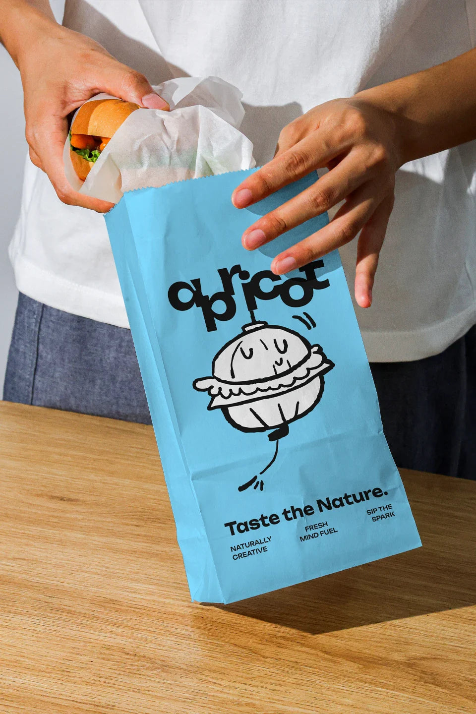 Mockup.Asia Apricots Coffee Collection bundle in a burger paper bag with the collection label and packaging details.