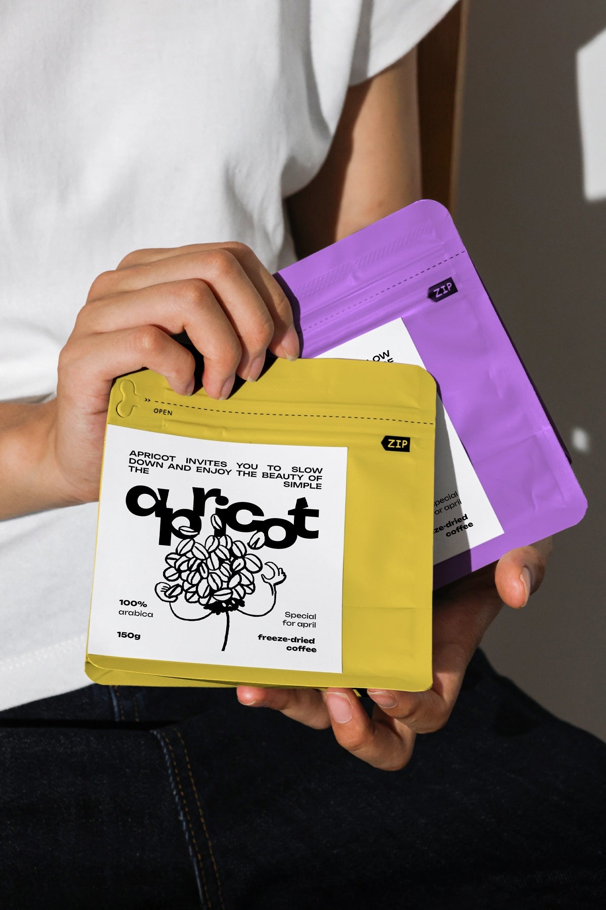 resealable coffee bag mockup in hands with clean label design, modern packaging template