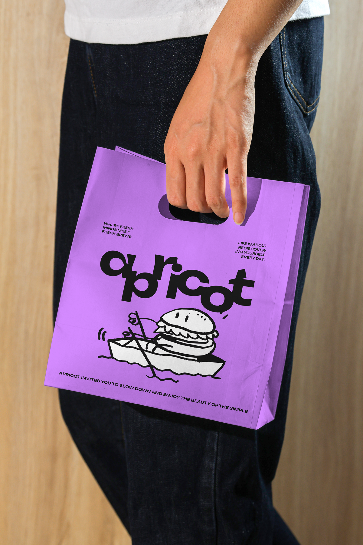 Lifestyle coffee paper bag mockup carried by hand, minimal white packaging design