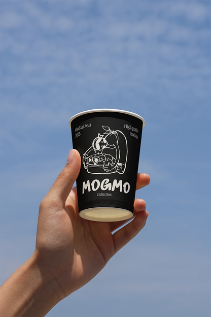 realistic takeaway coffee cup mockup in hand with clean sky background and soft daylight