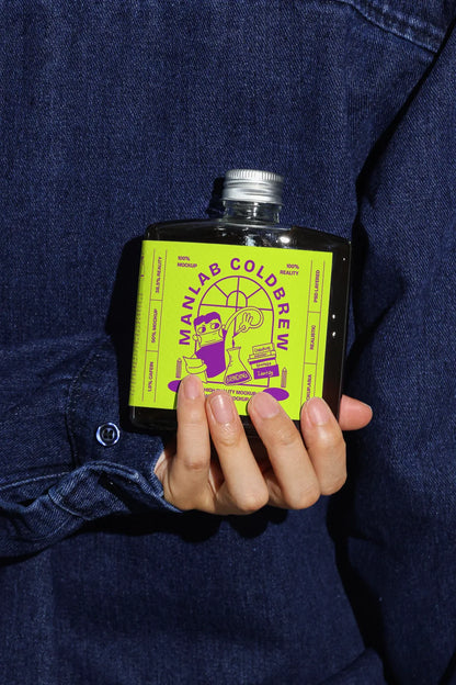 Coffee packaging bottle mockup held in hand for realistic product showcase
