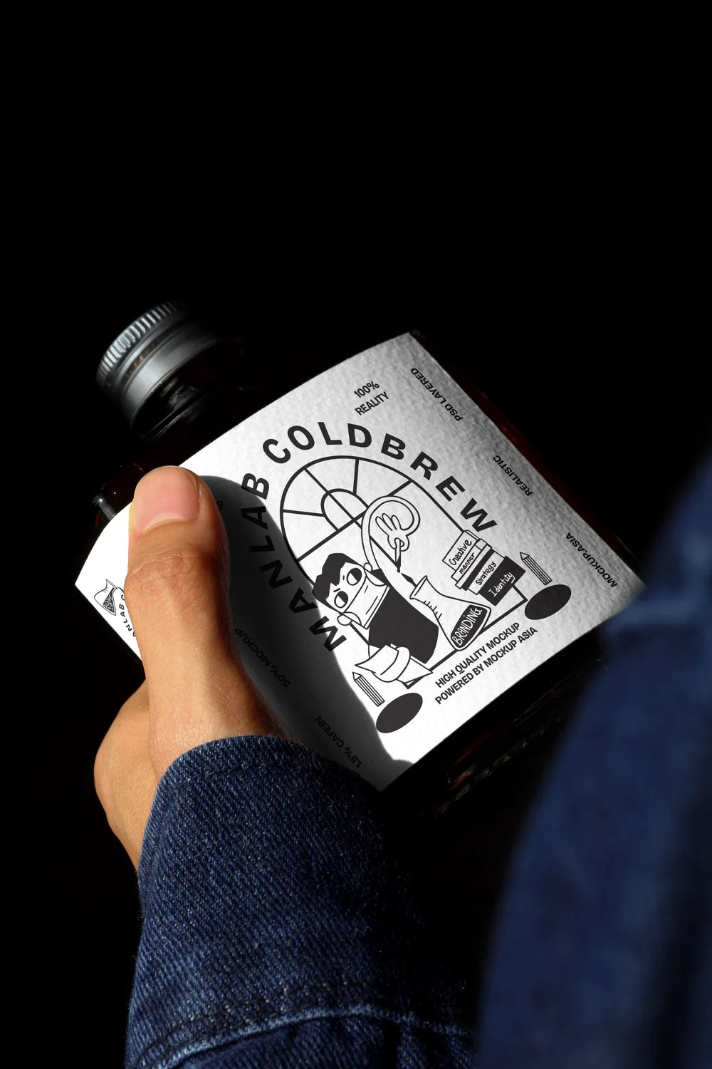 Dark cold brew bottle mockup held in hand with dramatic lighting and deep shadows
