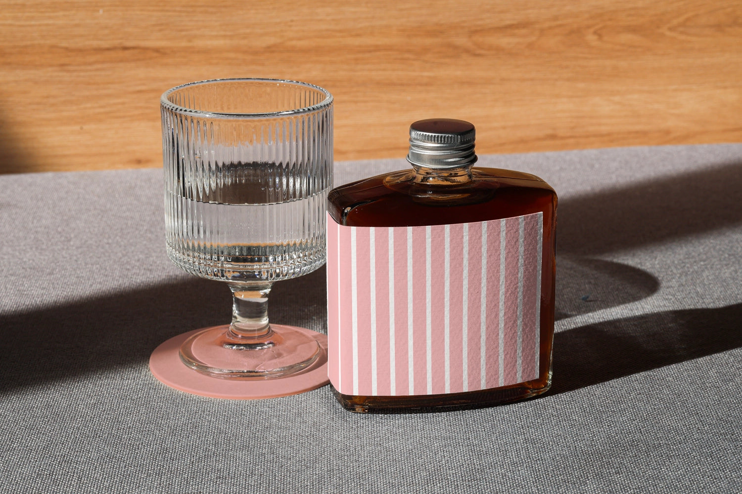 Cold brew drink bottle mockup with glass and natural light composition
