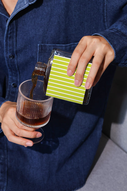 Coffee packaging mockup with close-up pouring moment and natural lighting
