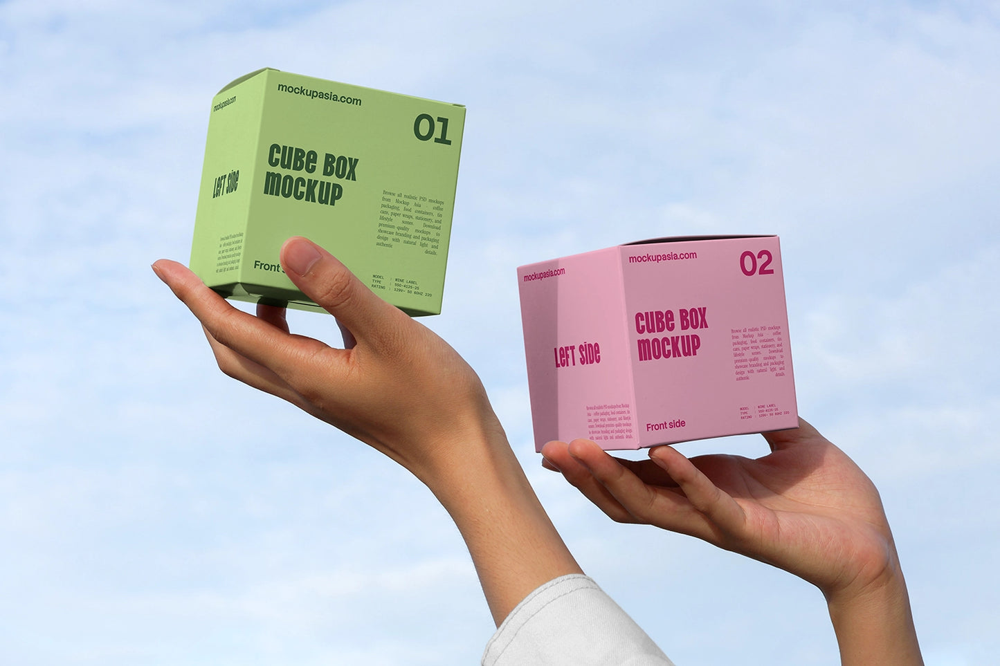 Minimal cube packaging mockup with handheld boxes and outdoor natural light scene