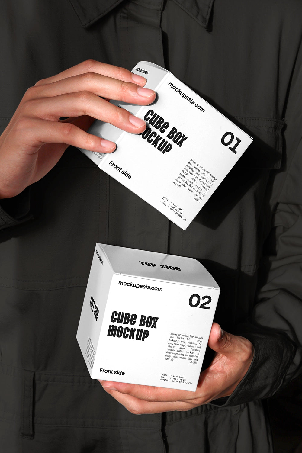 Cube box mockup with two packaging boxes held in hands dark background close up