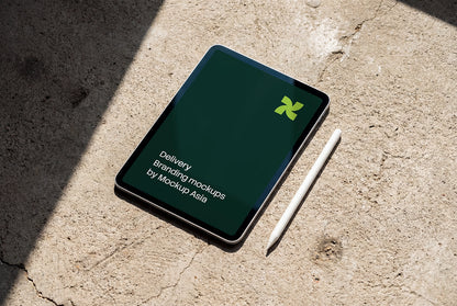 iPad Pro 11-inch mockup on concrete surface with Apple Pencil