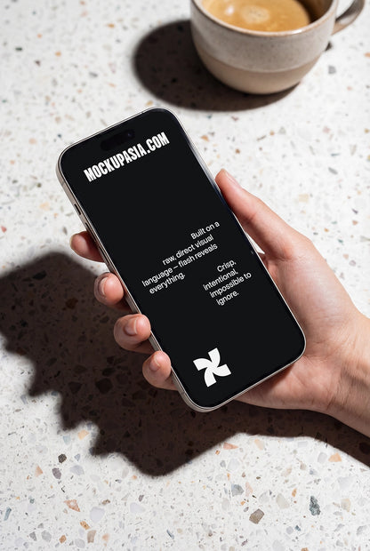 smartphone mockup held in hand on terrazzo table with bold shadows
