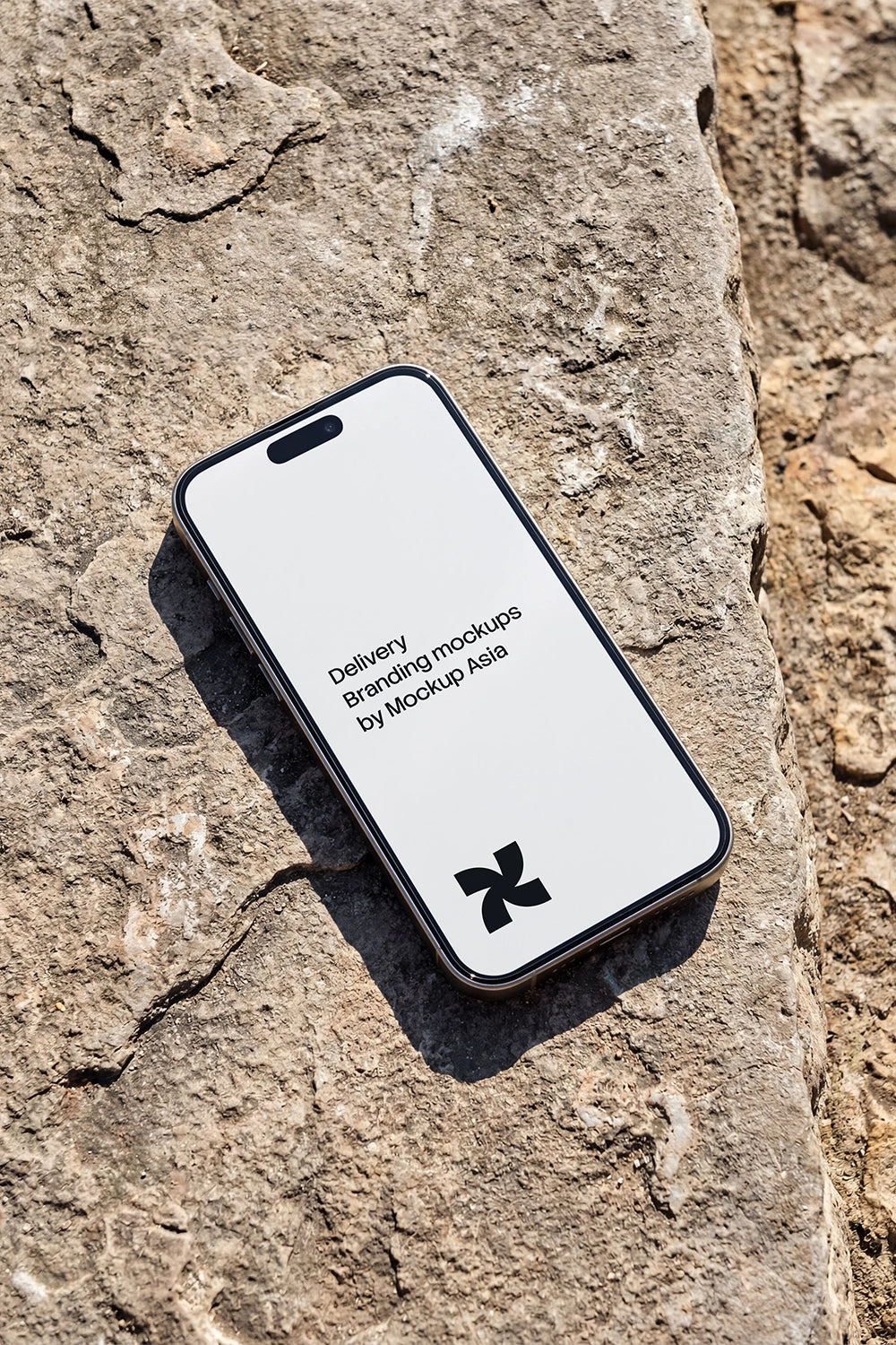iPhone 16 Pro mockup PSD on concrete surface outdoors