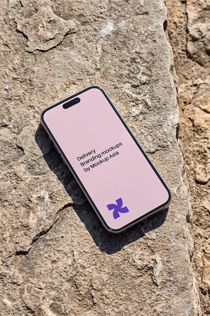 iPhone mockup on textured concrete with natural sunlight

