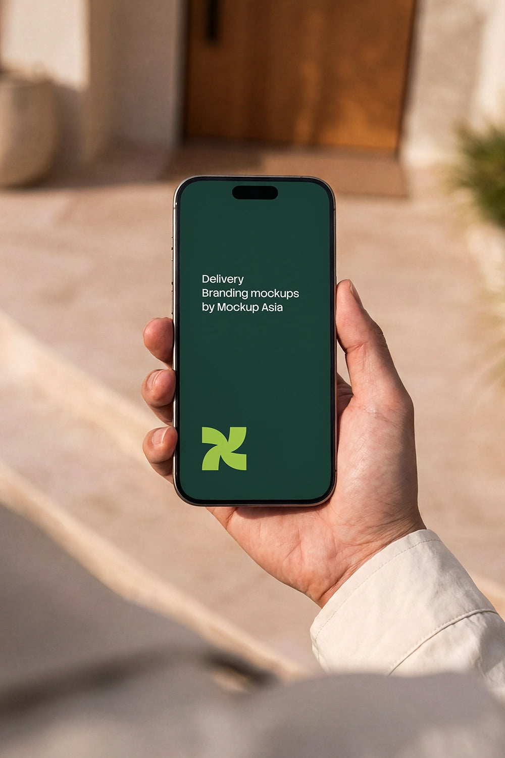 Realistic iPhone 16 Pro hand mockup for mobile UI presentation in outdoor lifestyle setting