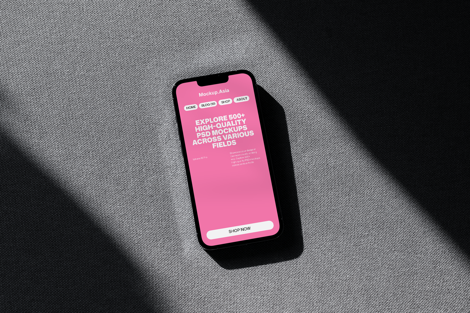 iPhone screen mockup in flat lay view with strong shadow lighting and fabric texture
