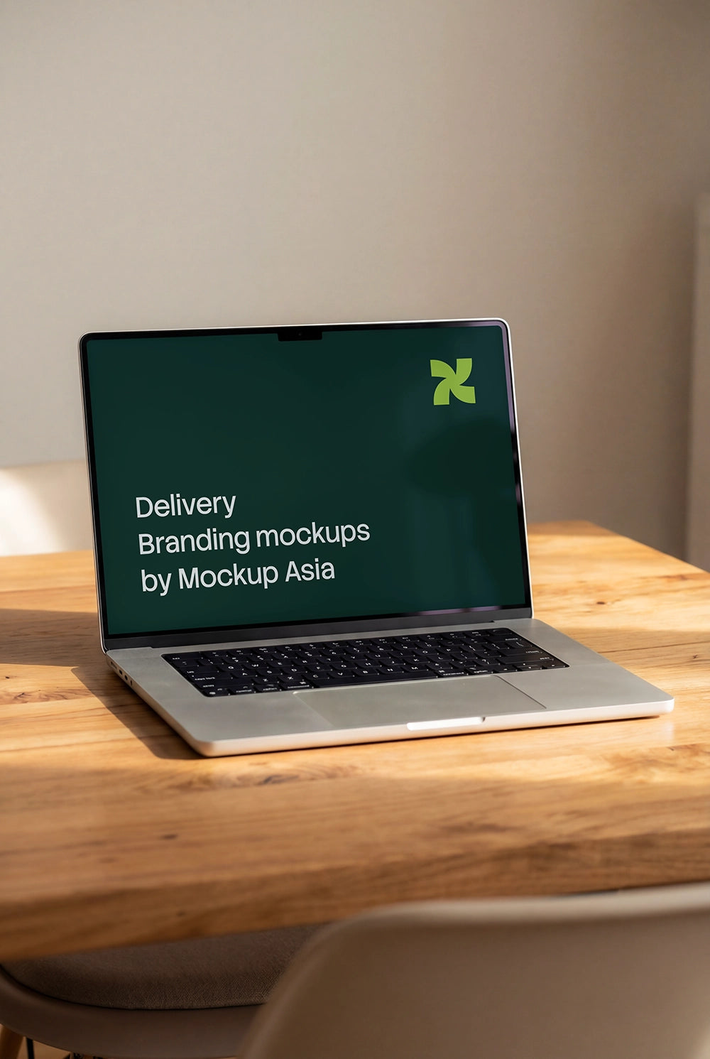 MacBook Pro 16-inch mockup on wooden table with editable screen