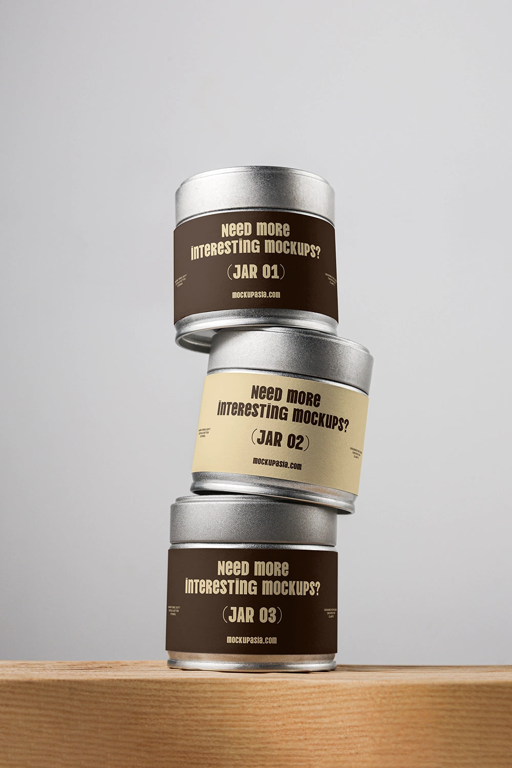 matcha tin packaging mockup set stacked vertically on wooden surface, modern branding display