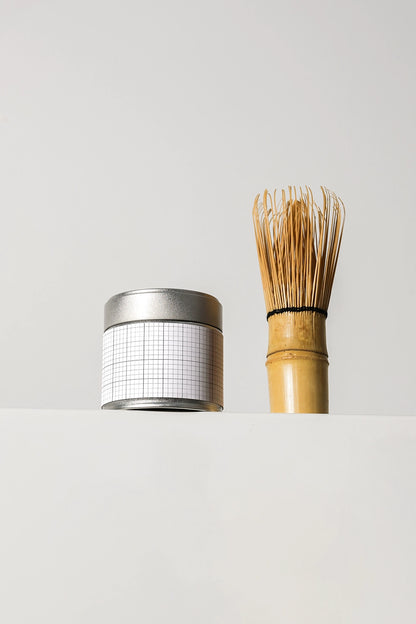 tea tin container mockup with bamboo whisk, minimal aesthetic product presentation