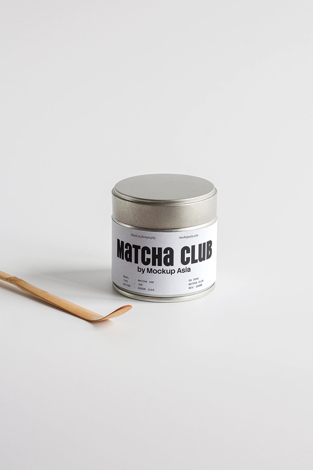 Open matcha tin jar with bamboo chasaku scoop on a minimal white backdrop – editable PSD mockup MCH11