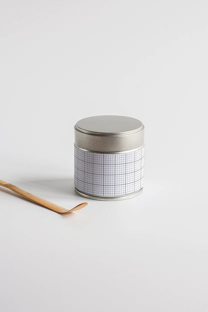 tea tin container mockup with wooden spoon on white background, simple branding setup