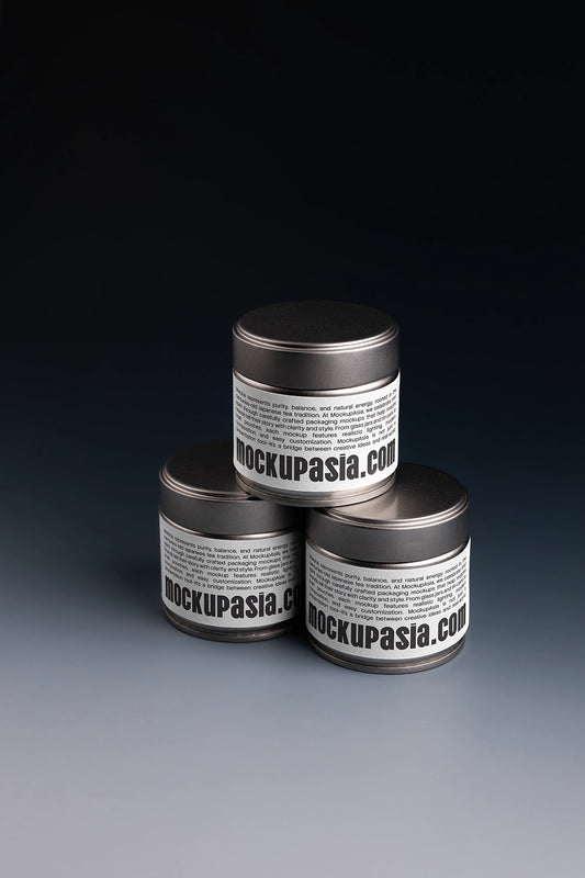 matcha tin can mockup set with three containers on dark background, studio lighting presentation