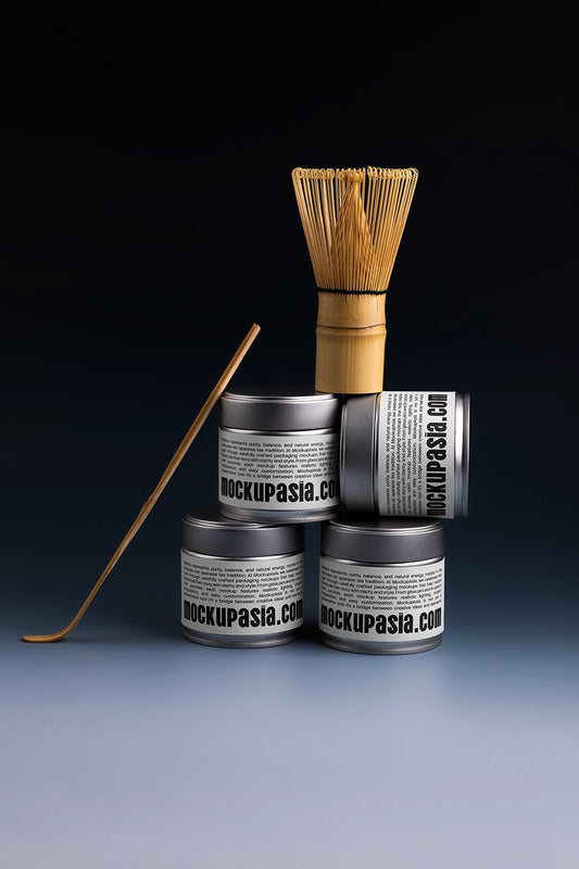 matcha tin can mockup stacked with bamboo whisk on top, dark studio packaging presentation