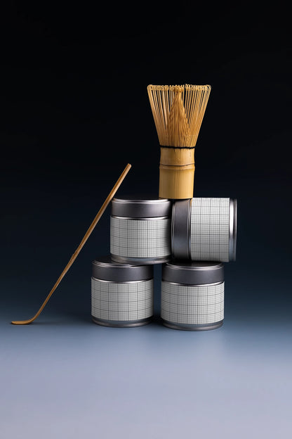 tea tin can mockup stack with matcha whisk and spoon, modern product branding scene