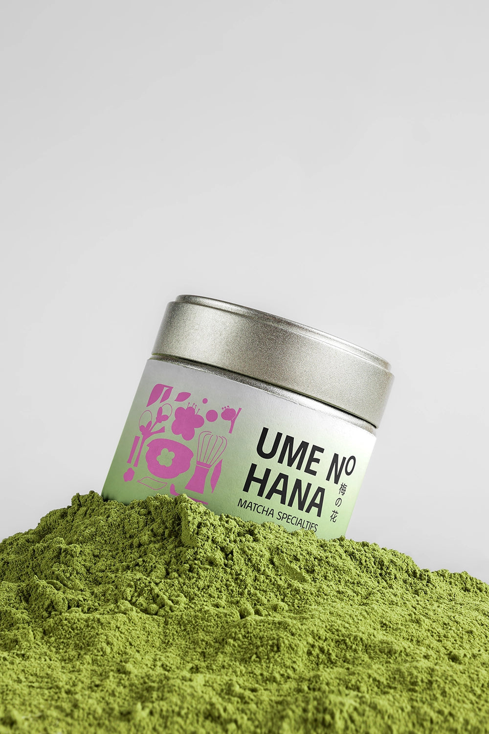 matcha tin mockup partially buried in green powder, realistic product texture presentation