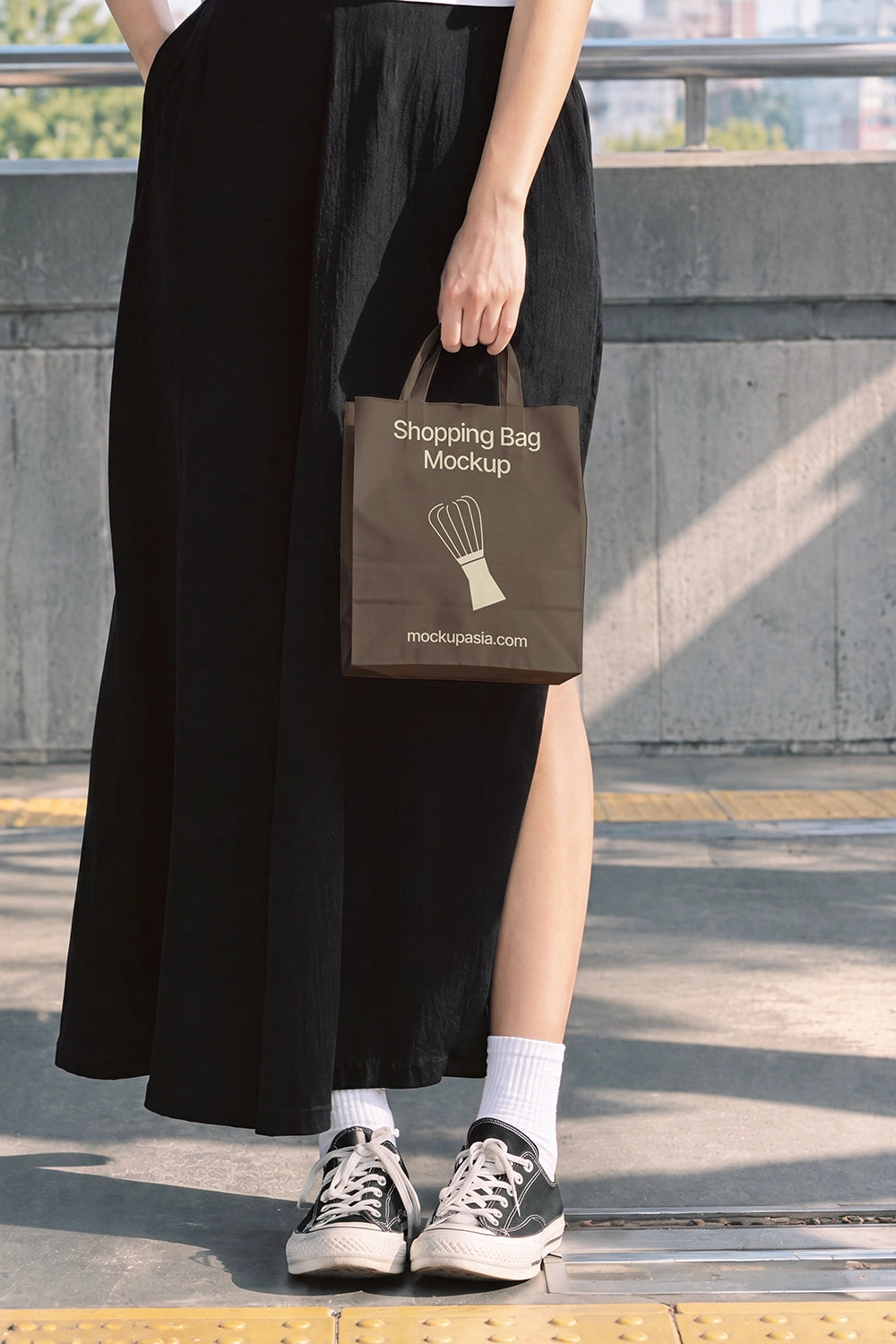 Streetwear packaging bag mockup woman in black skirt and sneakers