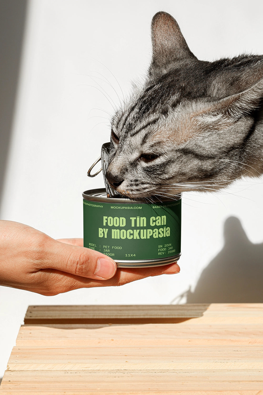 realistic cat food can mockup with human hand holding and open lid detail
