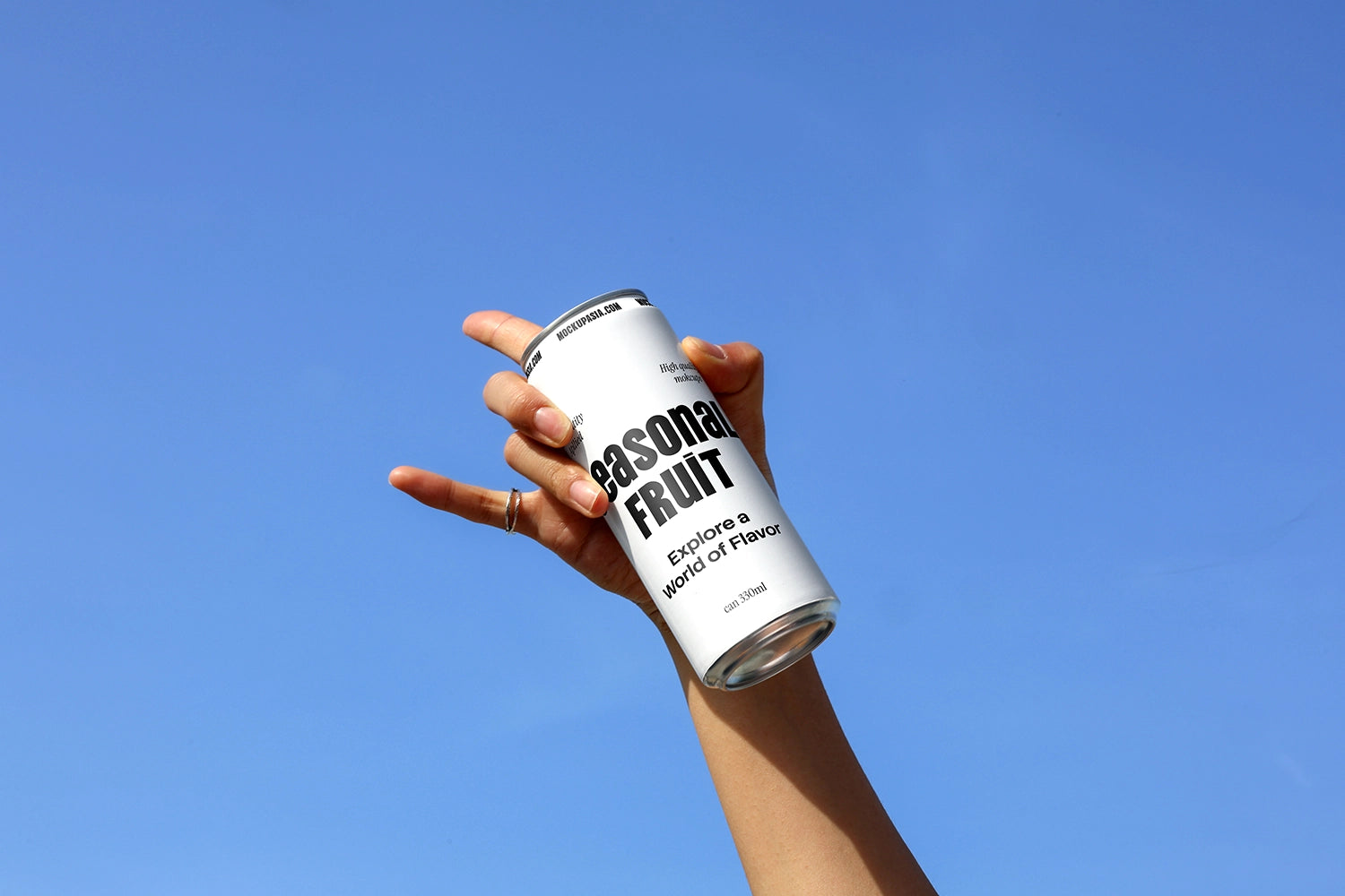 soda can mockup tilted in hand with bold gesture sky background