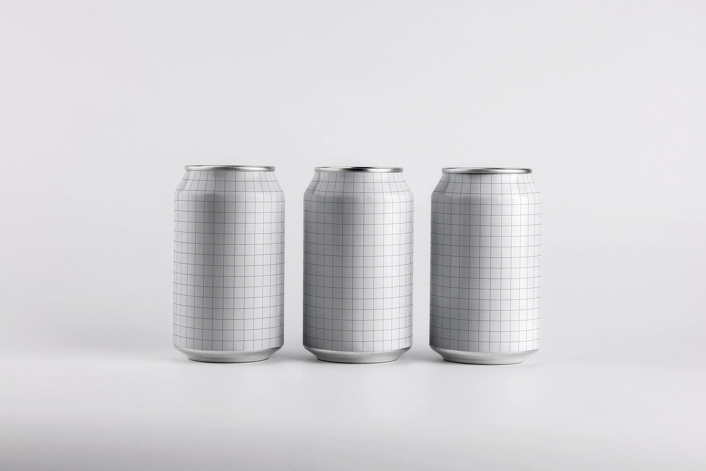 Minimal soda can mockup trio front perspective clean aluminum drink packaging PSD template