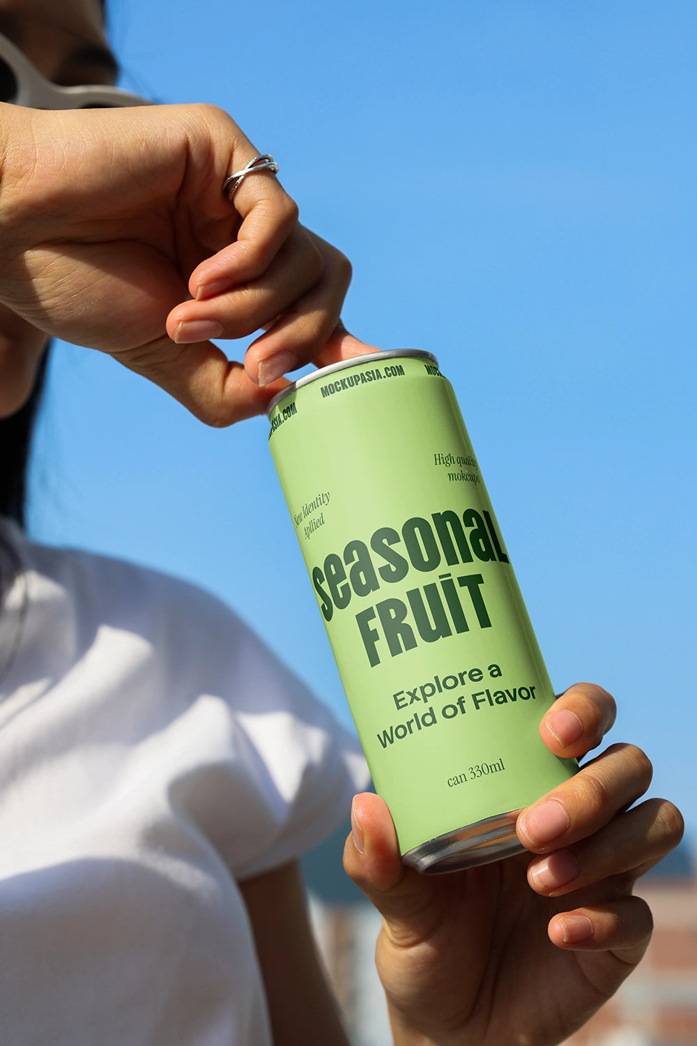 energy drink can mockup hand pulling tab outdoor composition