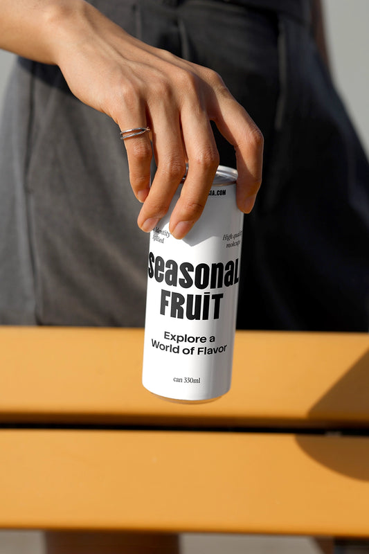 Minimal soda can mockup held by hand with clean outdoor background and natural sunlight