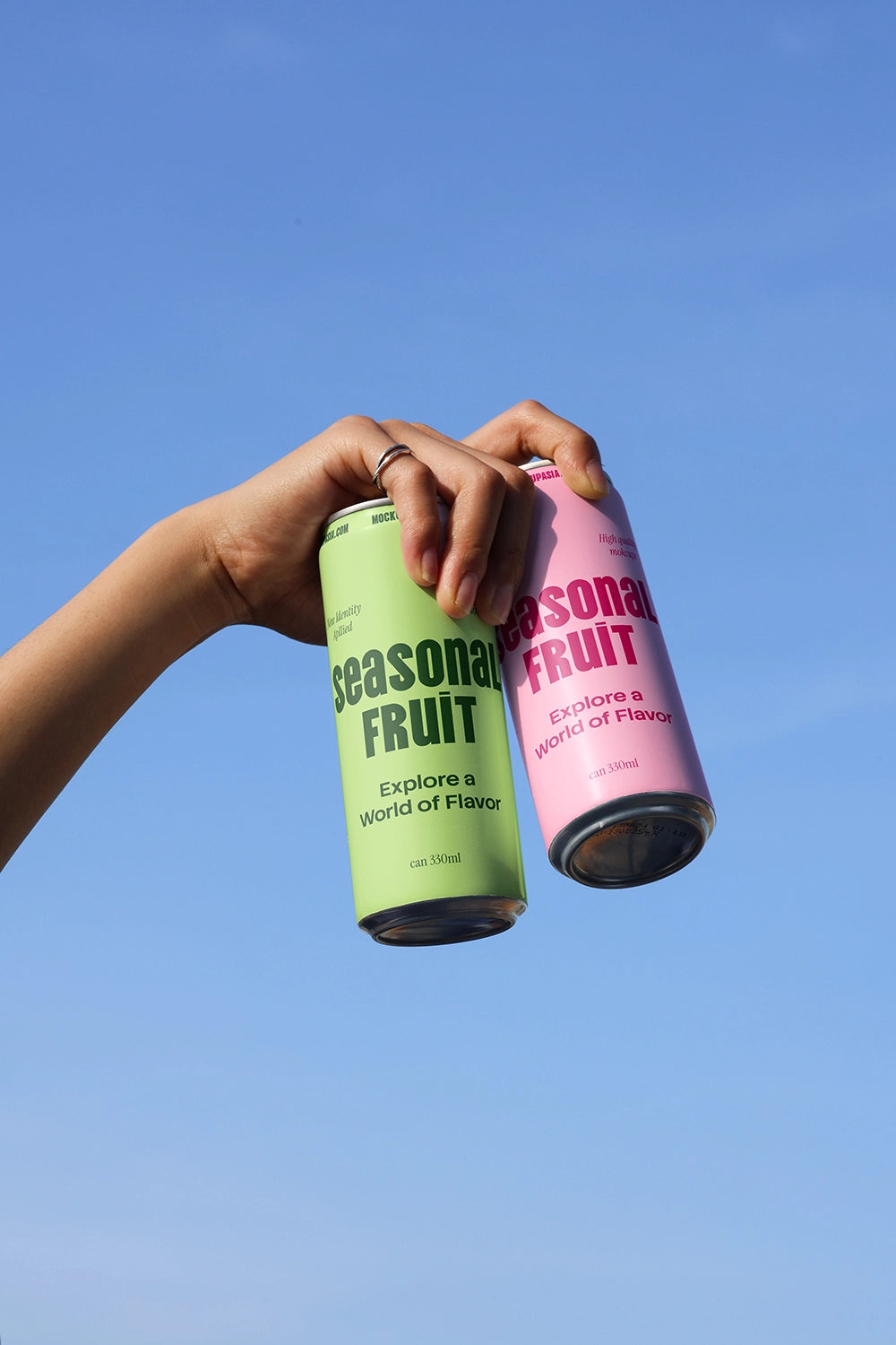 Two aluminum cans mockup with floating composition for soda and energy drink branding presentation