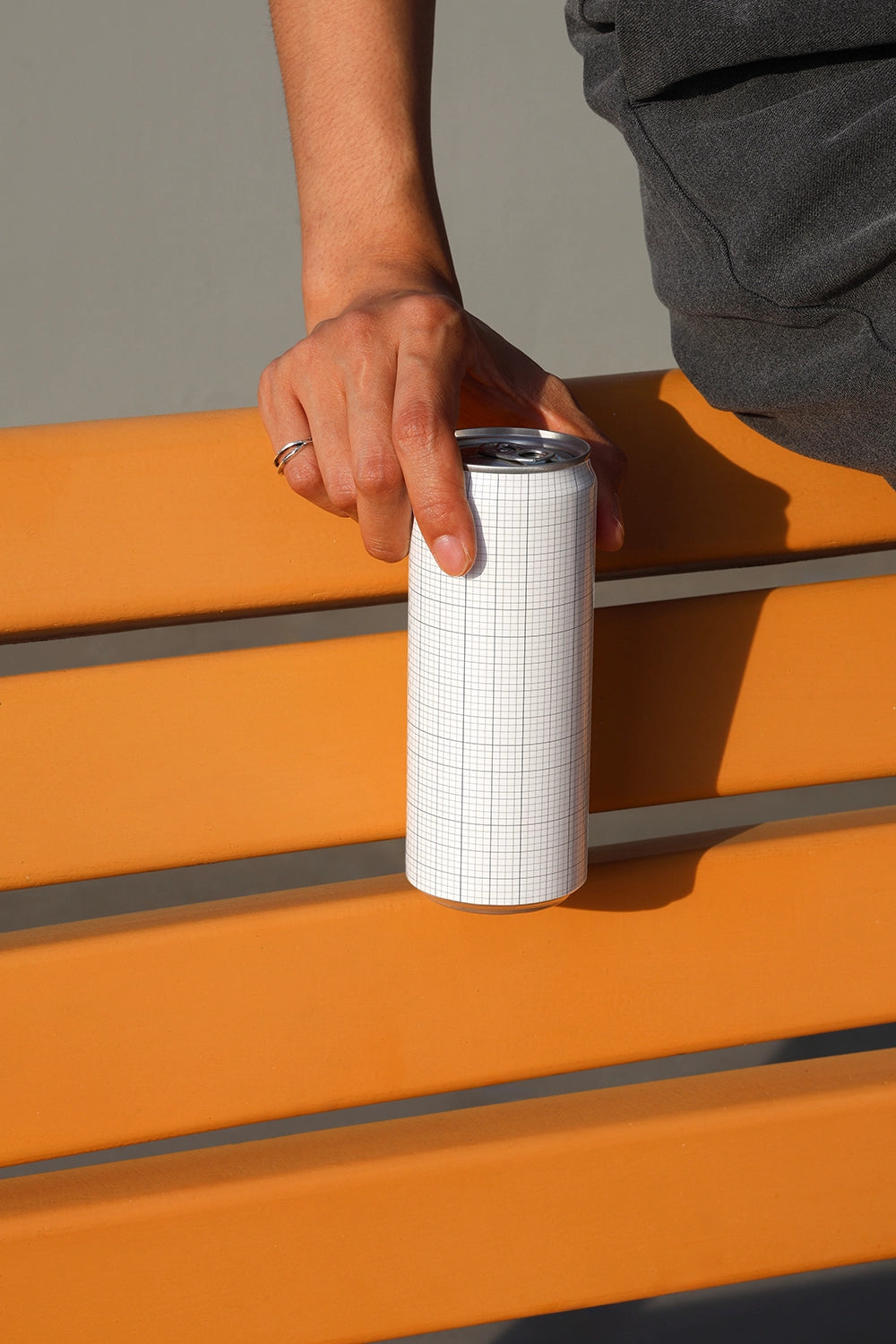 Aluminum soda can mockup with simple composition and strong shadows for modern branding presentation