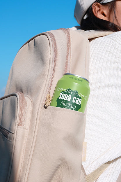 Drink can mockup inside backpack close up lifestyle branding presentation soft natural lighting