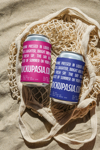 Two aluminum soda cans mockup with sand texture background for beverage packaging presentation