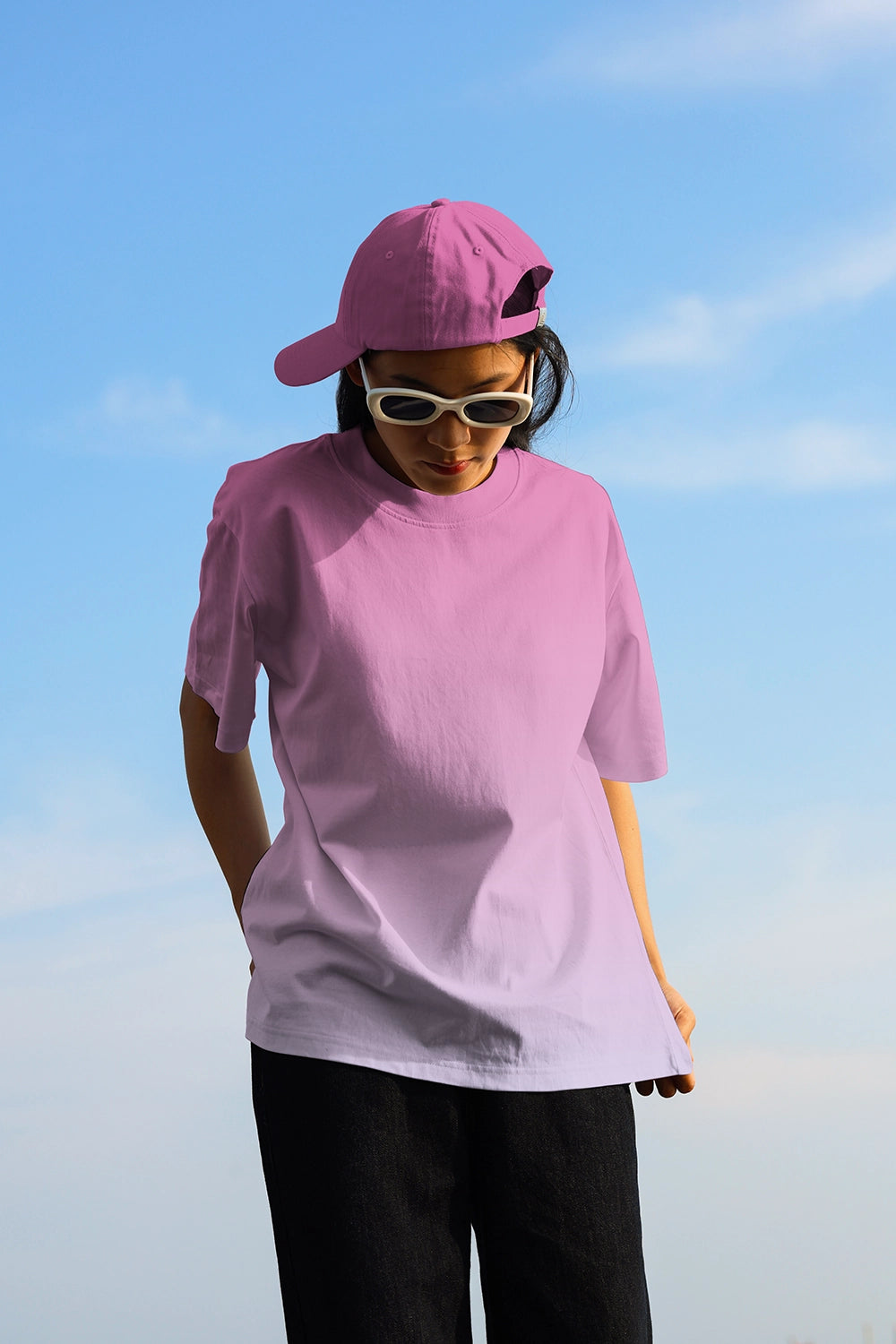 realistic t shirt mockup worn by person outdoor with clean sky and soft lighting